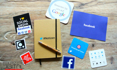 notepad and social media stickers for creating a social media plan